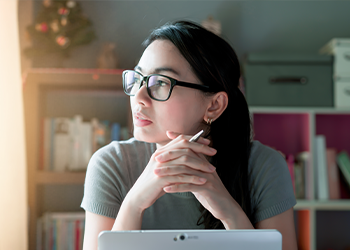 A young woman staring pensively into the distance