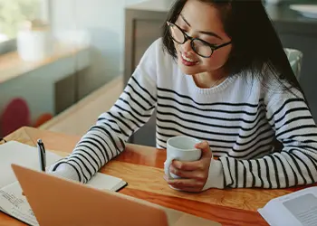 A young woman writing notes