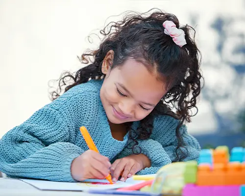 A child drawing with markers