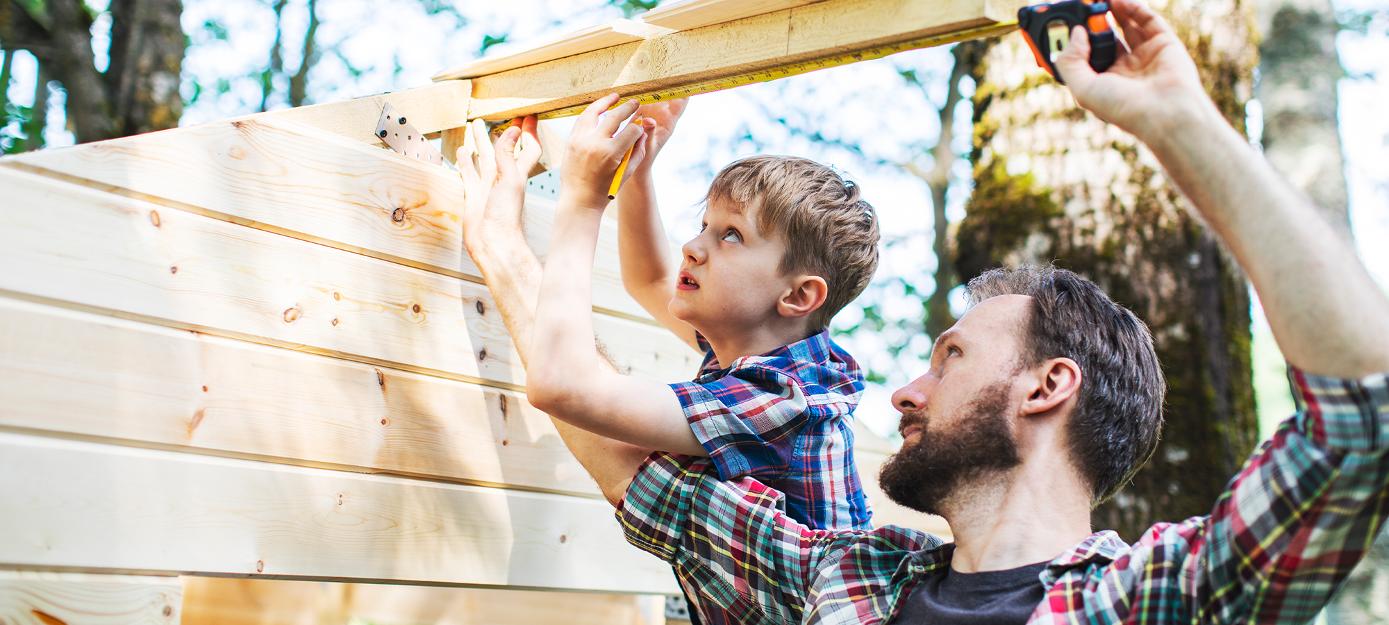 Father and son working on home construction