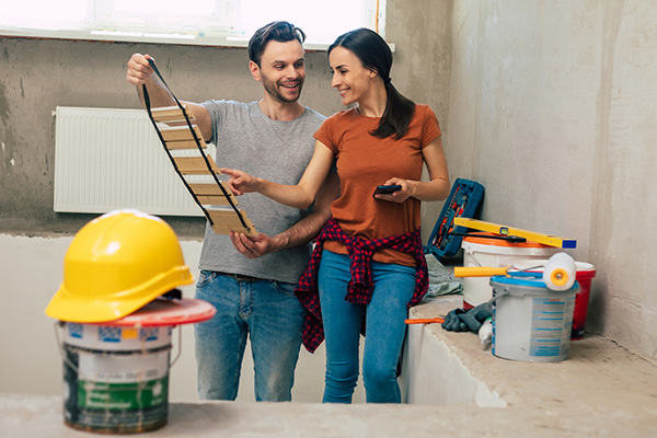 Couple working on construction project. 