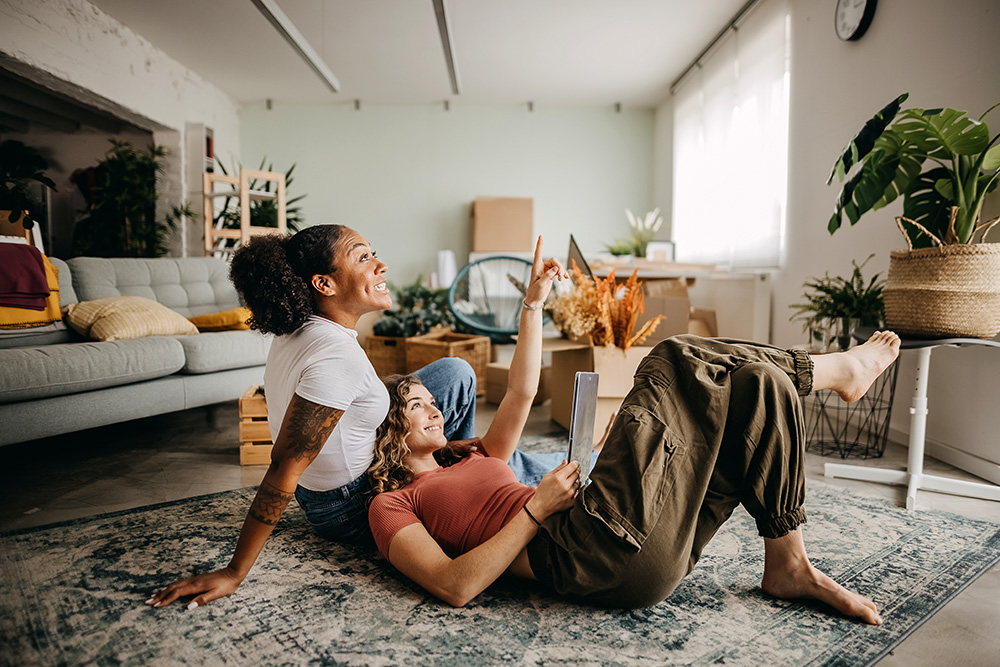 A young couple talking about room design.