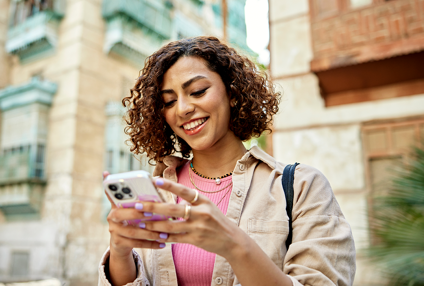 Traveling woman looking at her phone